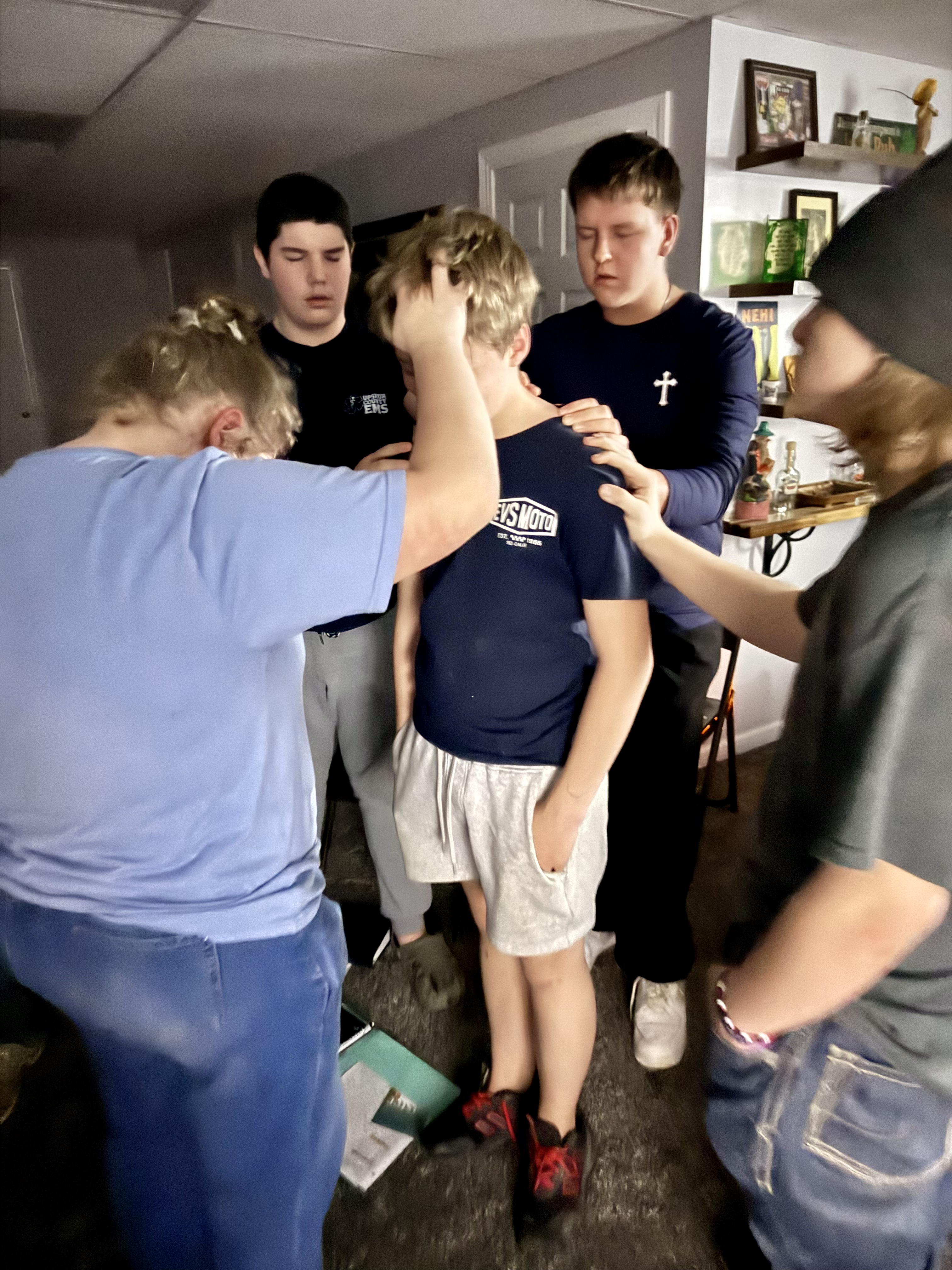 Teens praying together at The Gathering
